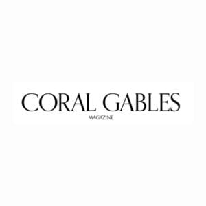 A black and white photo of the logo for coral gables magazine.