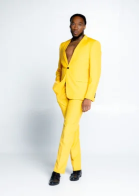 A man in yellow suit standing on white background.