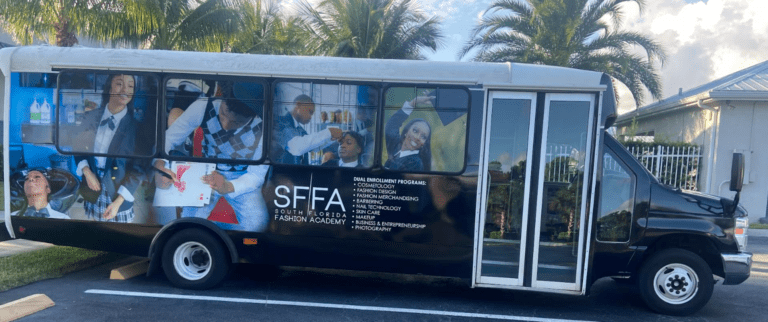 A bus with advertisements on the side of it.