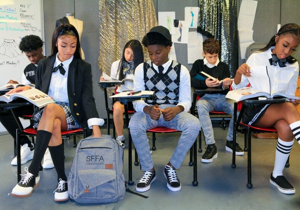 A group of students sitting in chairs at desks.